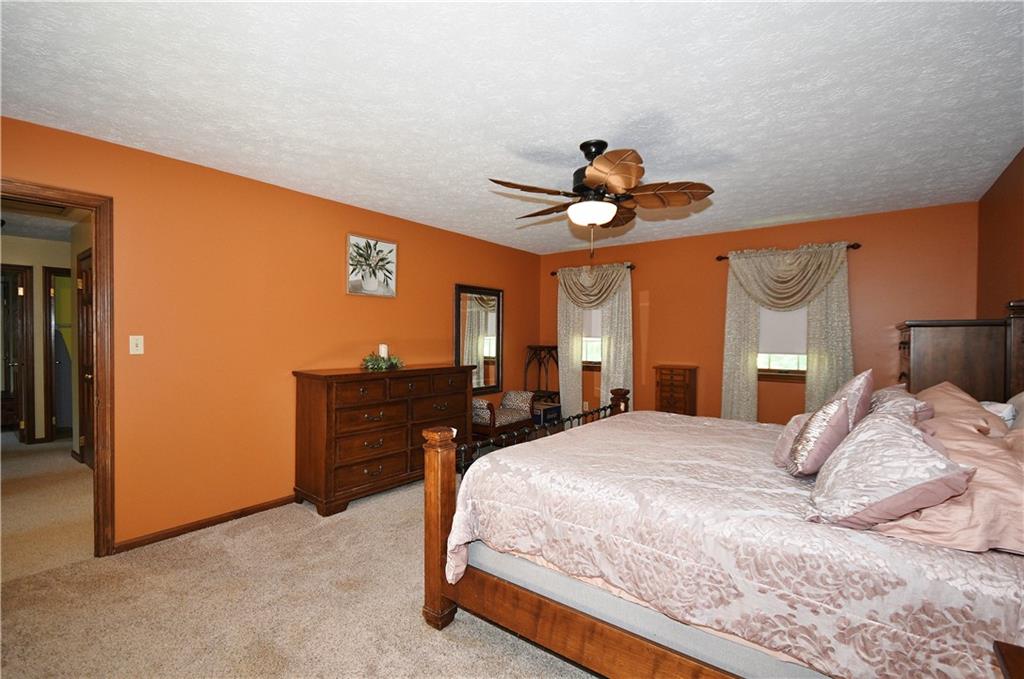 159 Klinger Road Canonsburg, PA 15317 - Photo 12 of 19 a bedroom with a bed and a chandelier