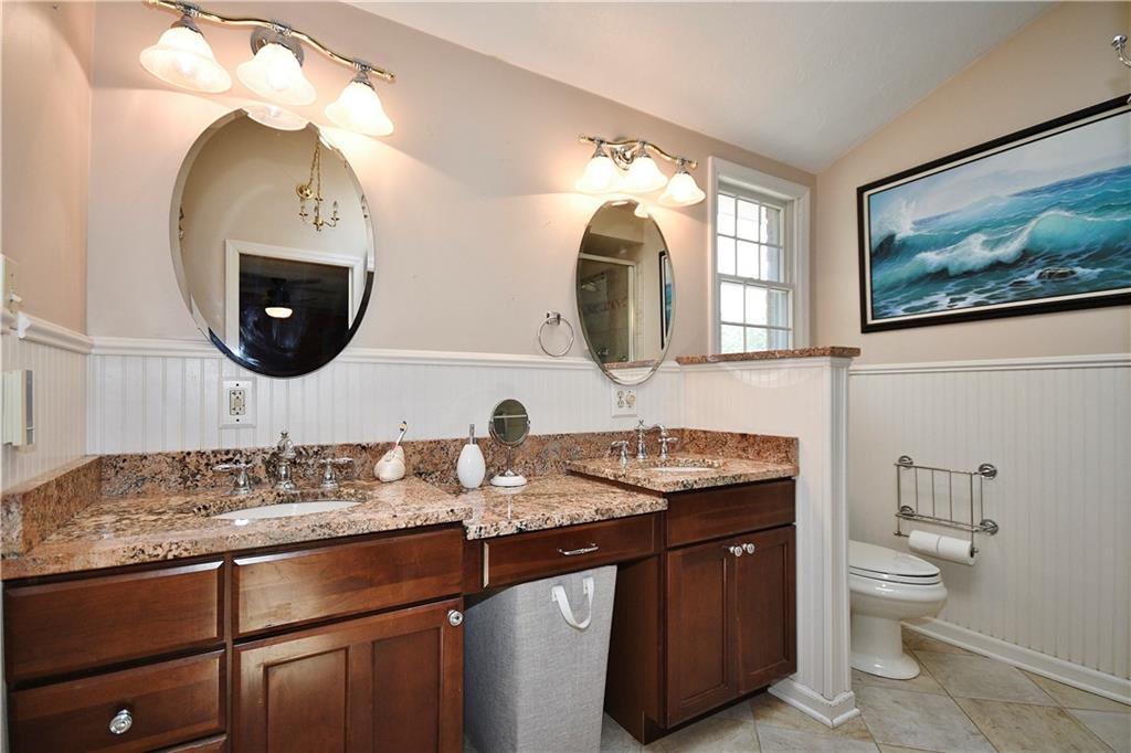 159 Klinger Road Canonsburg, PA 15317 - Photo 13 of 19 a bathroom with a toilet a sink and mirror