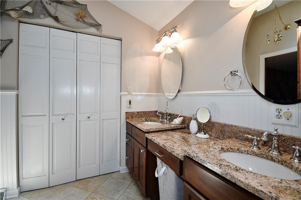 159 Klinger Road Canonsburg, PA 15317 - Photo 14 of 19 a bathroom with a granite countertop sink and a mirror