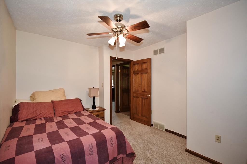 159 Klinger Road Canonsburg, PA 15317 - Photo 15 of 19 a bedroom with a bed and a chandelier