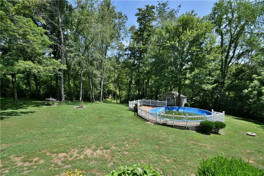 159 Klinger Road Canonsburg, PA 15317 - Photo 4 of 19 a small garden with wooden fence