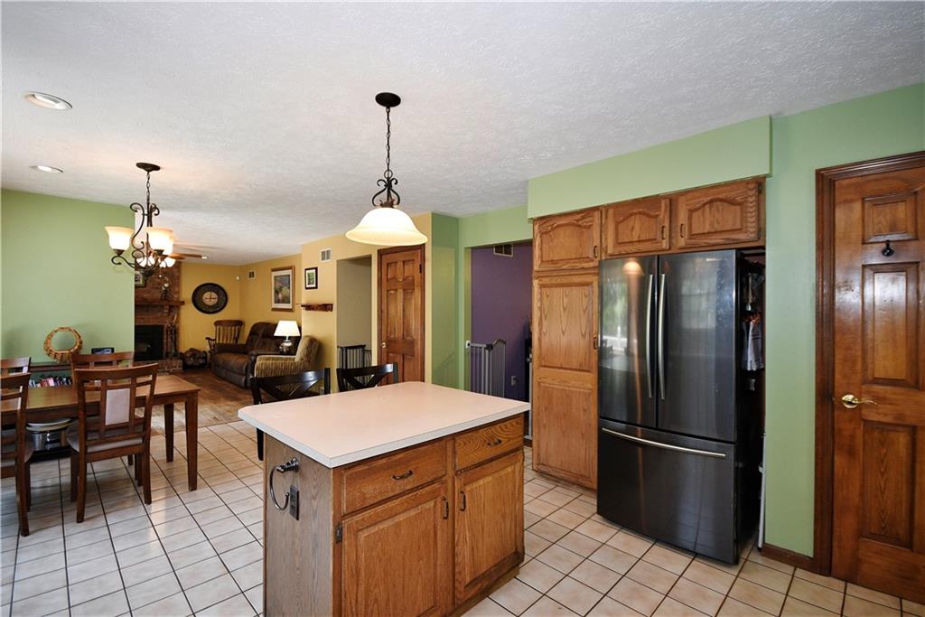 159 Klinger Road Canonsburg, PA 15317 - Photo 6 of 19 a kitchen with a chandelier a sink appliances and cabinets