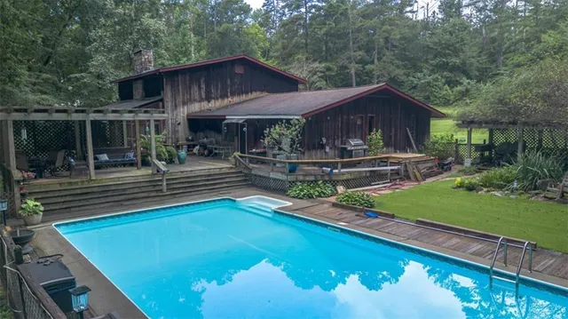 a front view of house with yard and outdoor seating