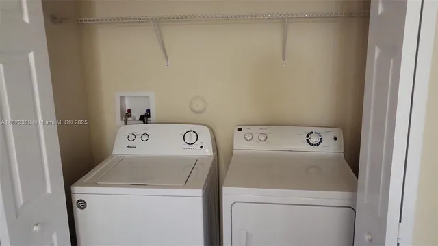 a utility room with dryer and washer