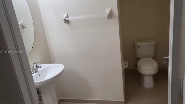 a bathroom with a toilet and a sink