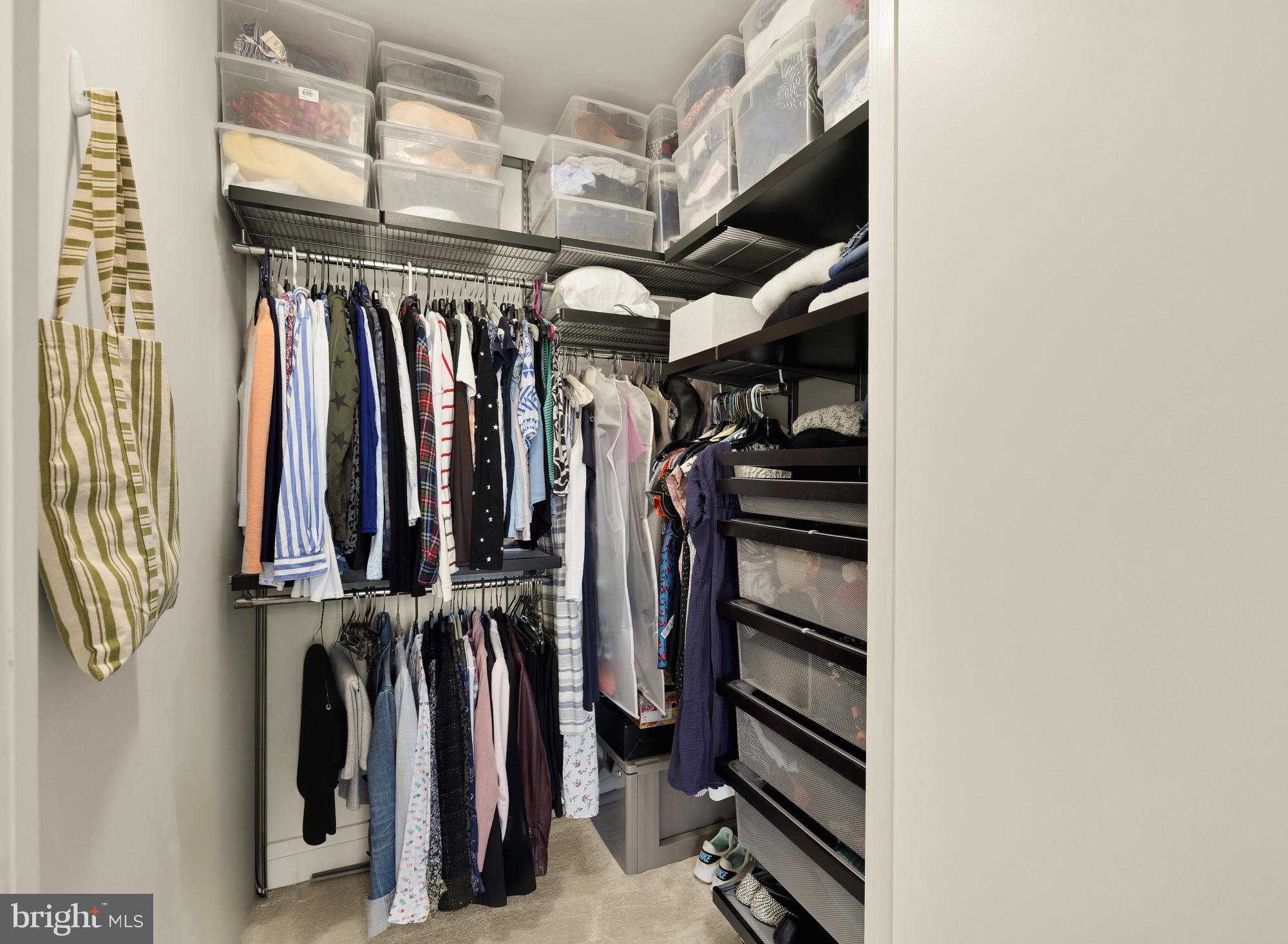 2020 12th Street Northwest, Unit 518 Washington, DC 20009 - Photo 12 of 28 a view of walk in closet with clothes and shoes