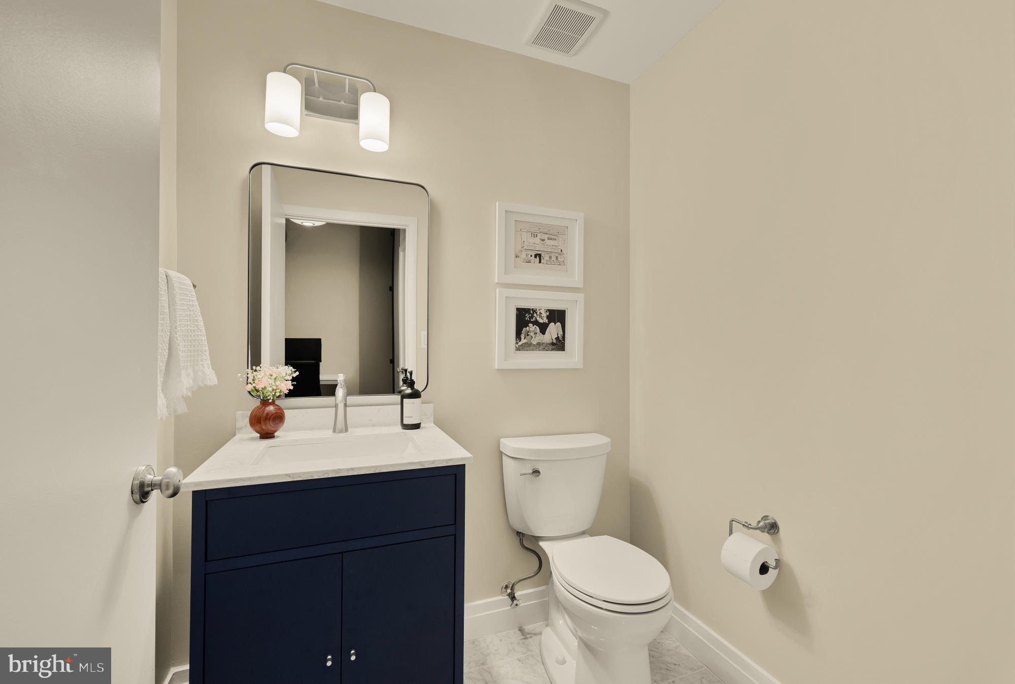 2020 12th Street Northwest, Unit 518 Washington, DC 20009 - Photo 15 of 28 a bathroom with a toilet a sink and mirror