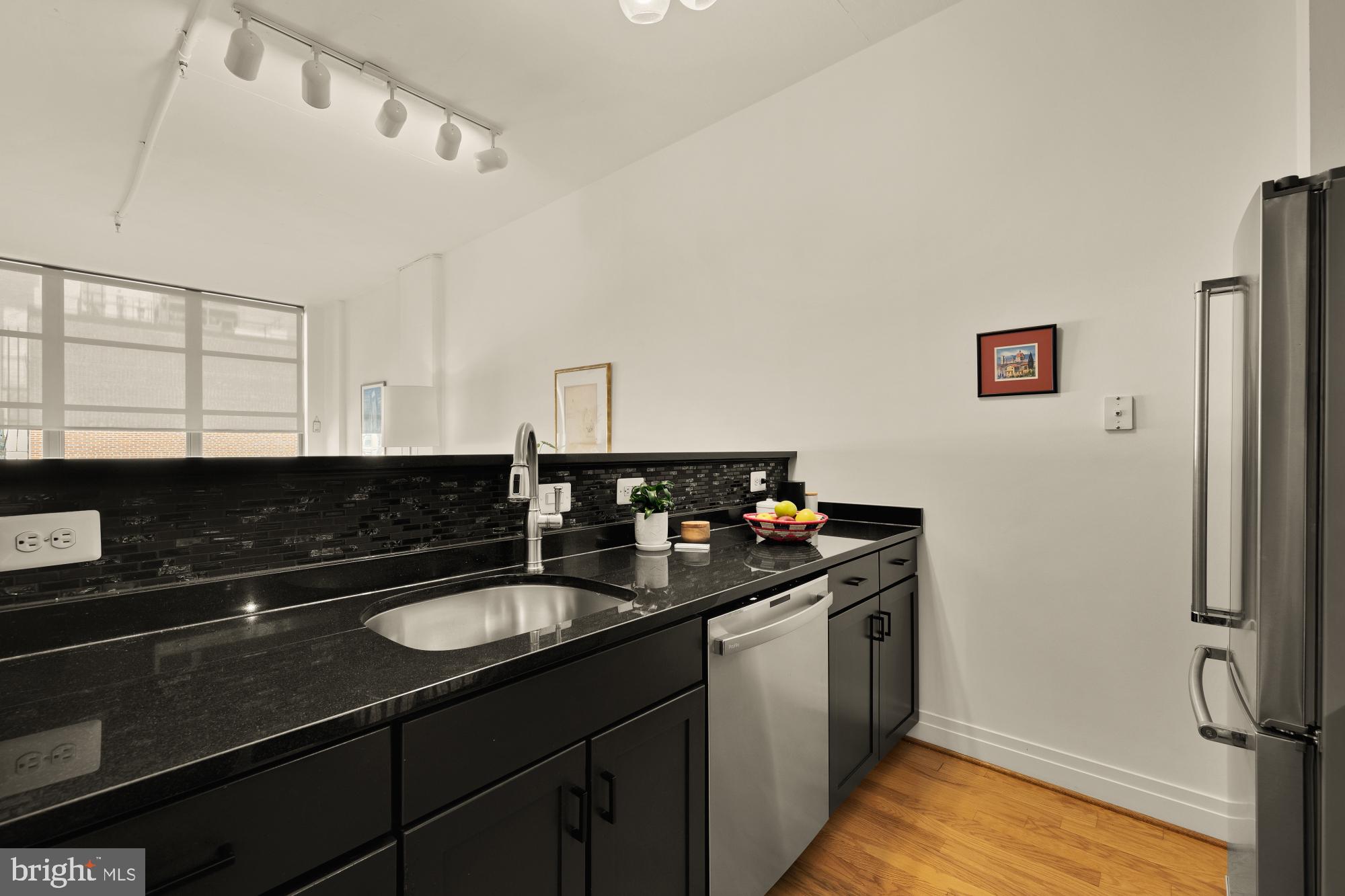 2020 12th Street Northwest, Unit 518 Washington, DC 20009 - Photo 7 of 28 a kitchen with a sink and a refrigerator