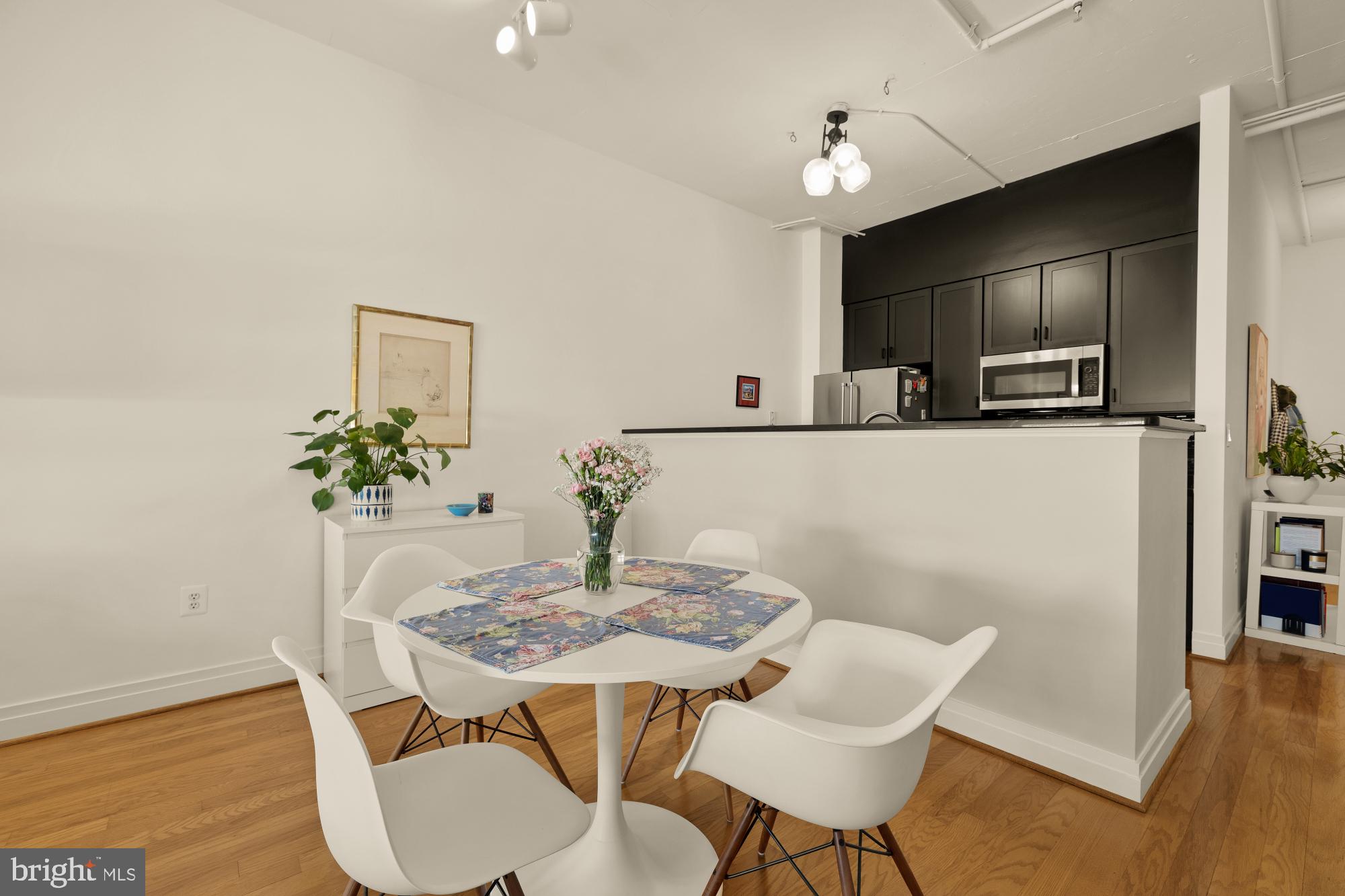2020 12th Street Northwest, Unit 518 Washington, DC 20009 - Photo 8 of 28 a view of a dining room with furniture and wooden floor