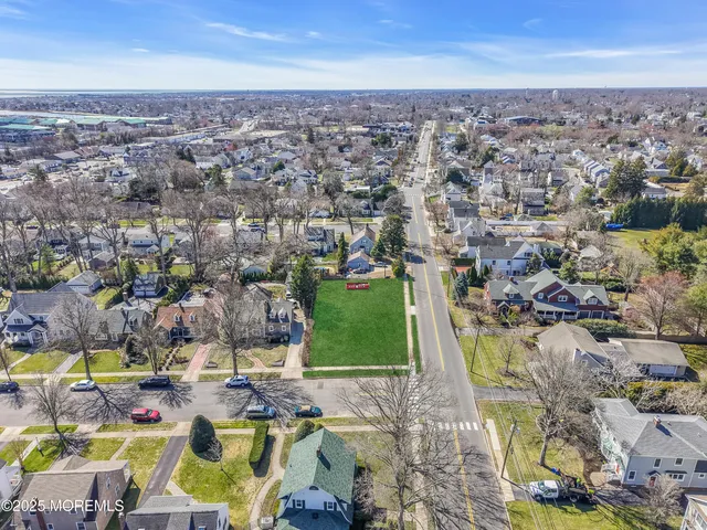 an aerial view of residential building with green space