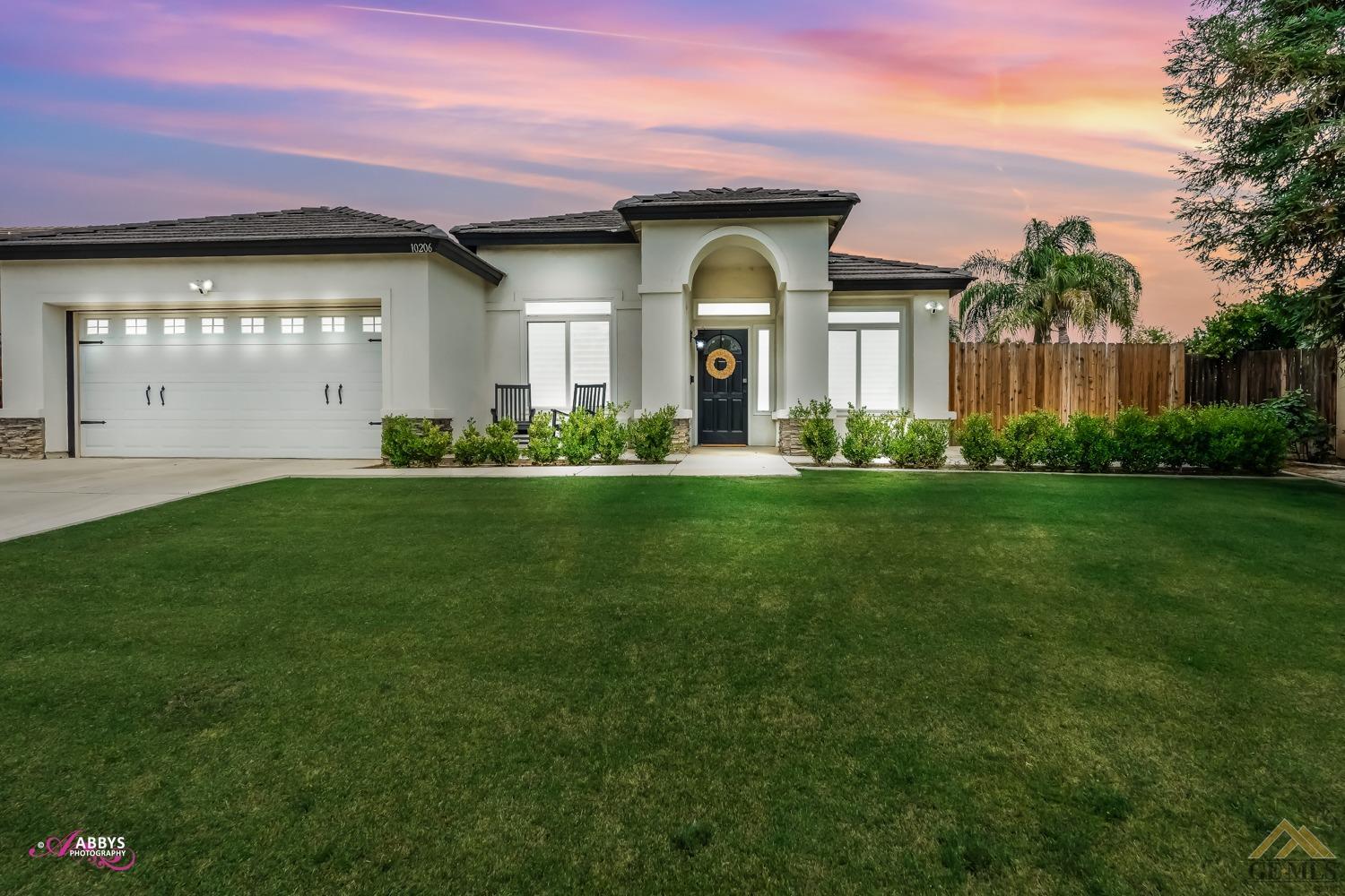 Undisclosed Address Bakersfield, CA 93311 - Photo 1 of 48 a front view of a house with a yard