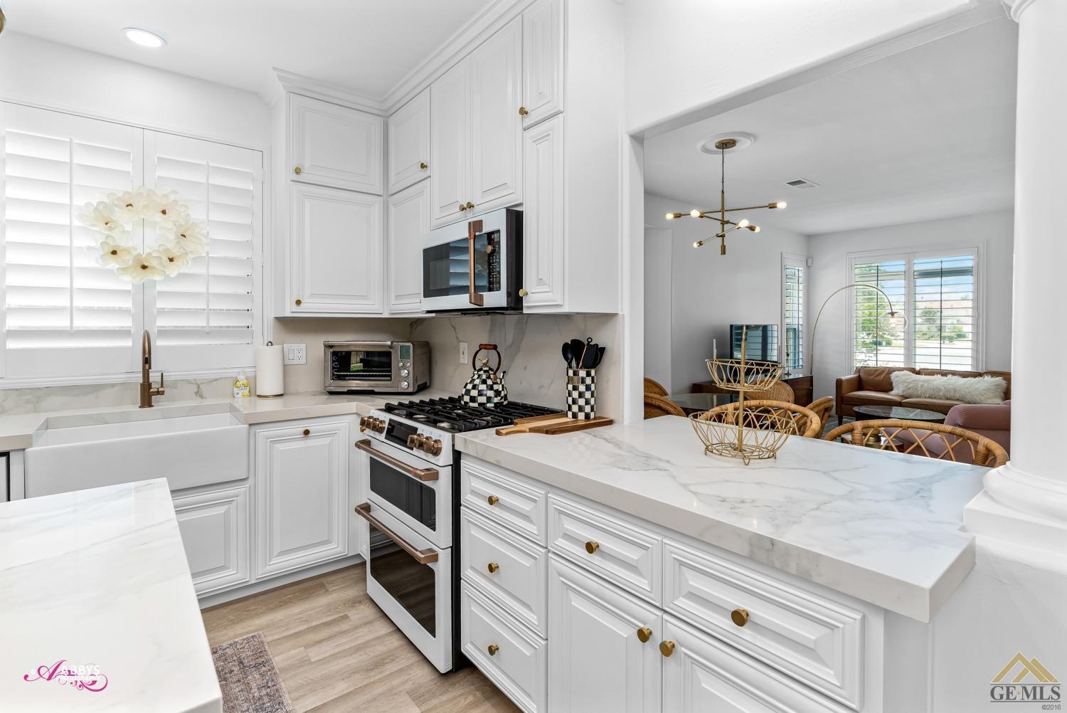 Undisclosed Address Bakersfield, CA 93311 - Photo 18 of 48 a kitchen with stainless steel appliances granite countertop a stove a sink and a refrigerator