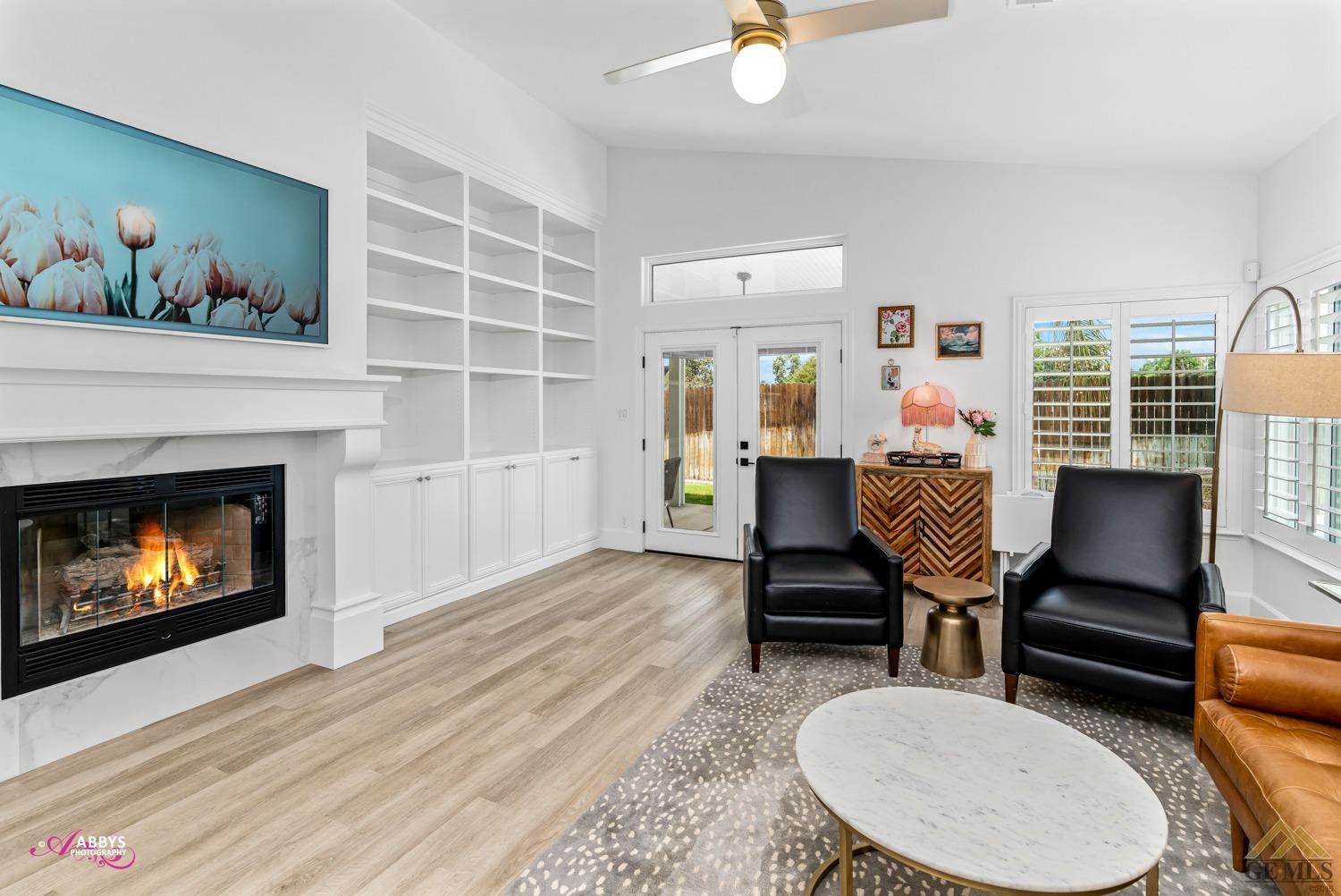 Undisclosed Address Bakersfield, CA 93311 - Photo 20 of 48 a living room with furniture and a fireplace