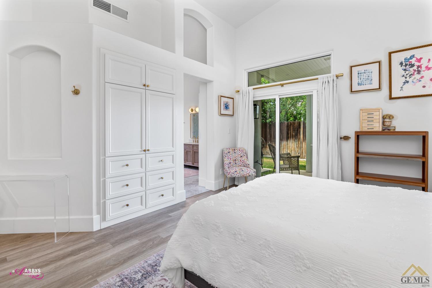 Undisclosed Address Bakersfield, CA 93311 - Photo 29 of 48 a spacious bedroom with a bed and a dresser