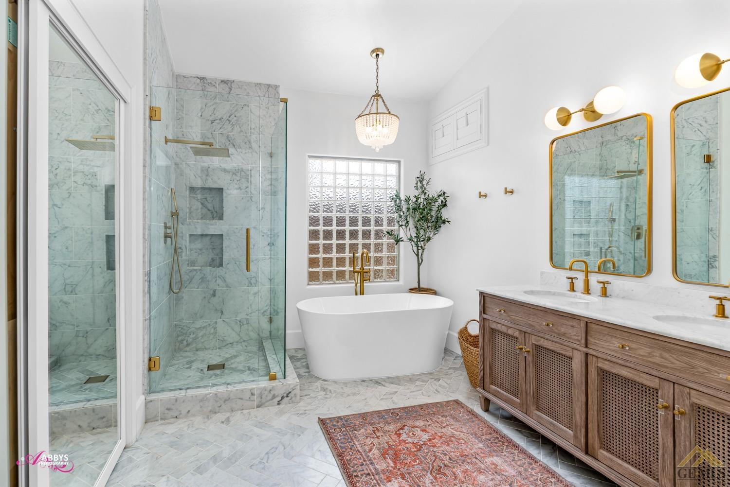 Undisclosed Address Bakersfield, CA 93311 - Photo 30 of 48 Primary bath has newer shower and tub, tile flooring and vanities.