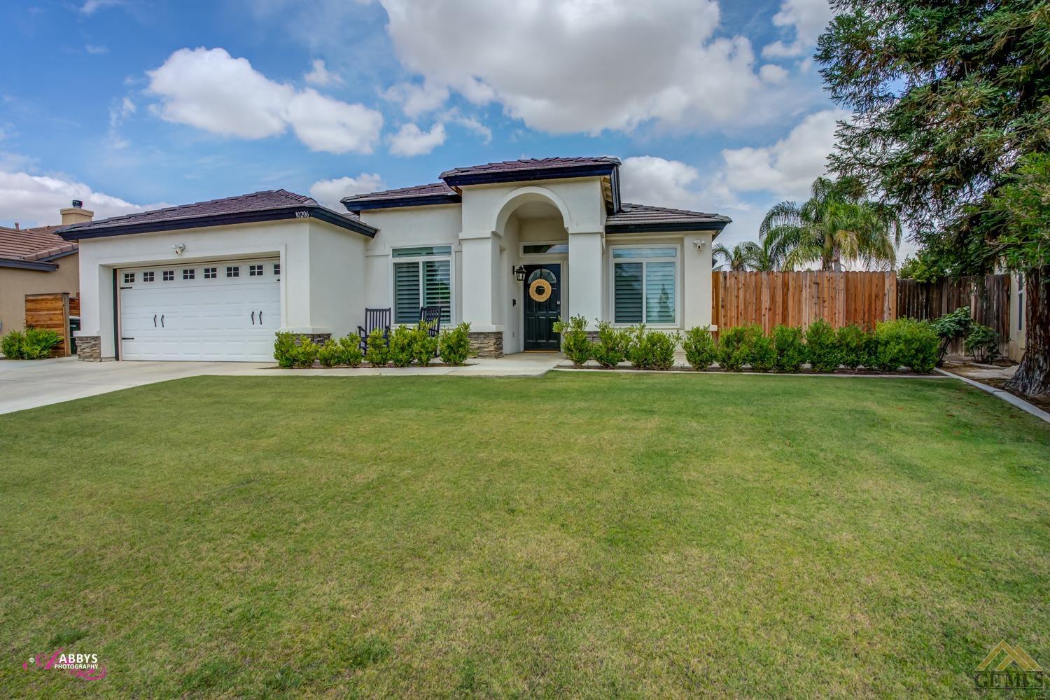 Undisclosed Address Bakersfield, CA 93311 - Photo 3 of 48 a front view of a house with garden