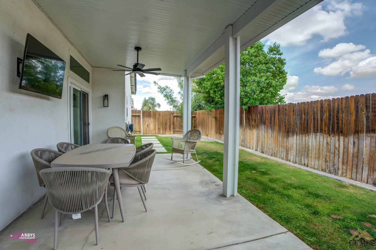 Undisclosed Address Bakersfield, CA 93311 - Photo 32 of 48 a view of an outdoor dining space with a table and chairs