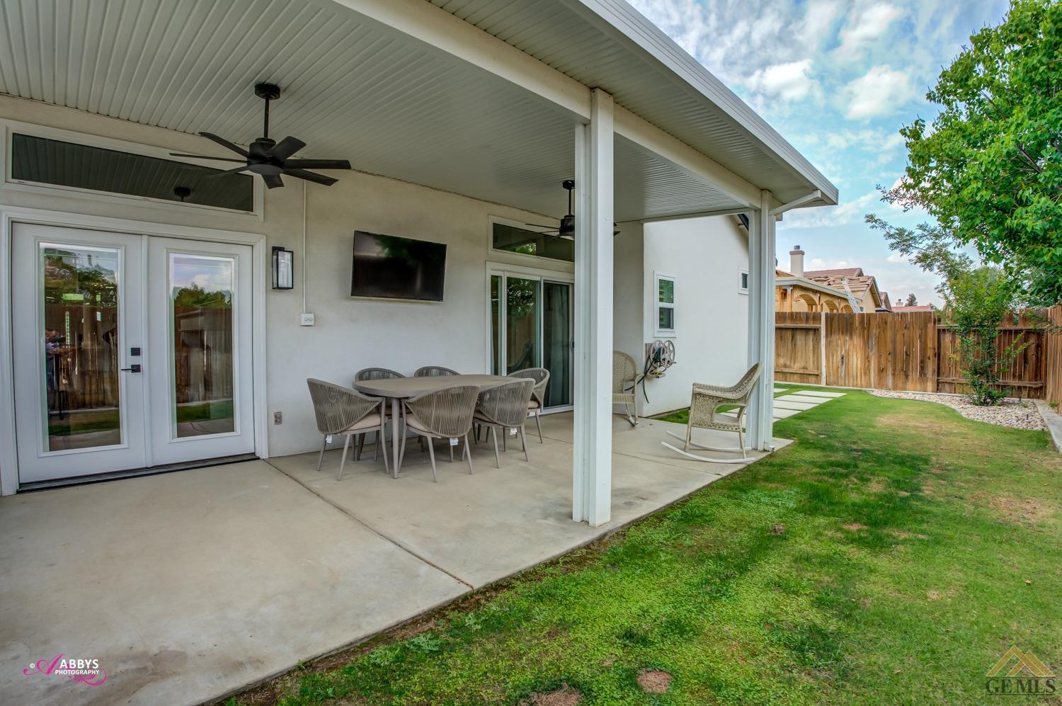 Undisclosed Address Bakersfield, CA 93311 - Photo 33 of 48 a view of a house with backyard and a patio