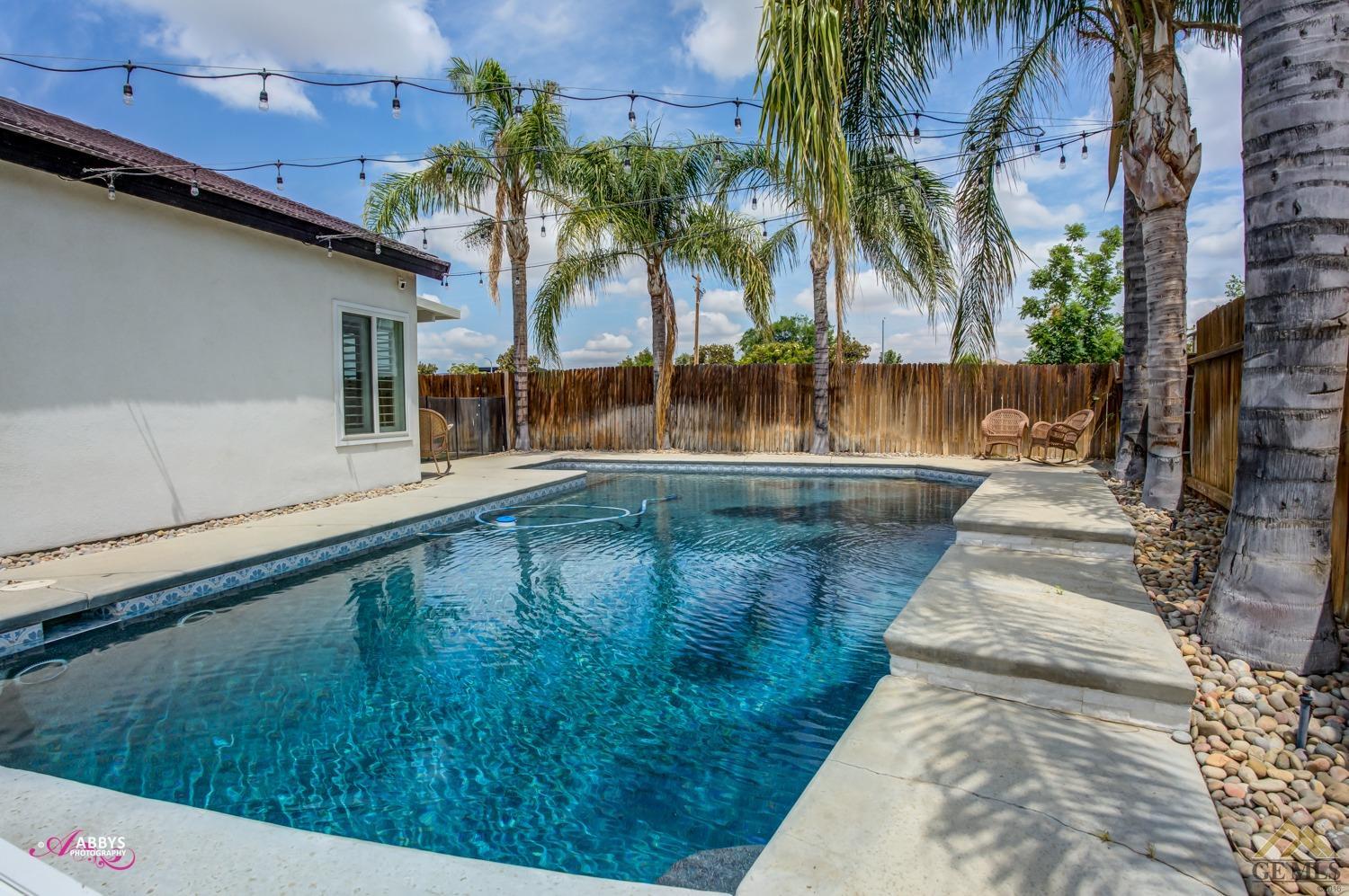 Undisclosed Address Bakersfield, CA 93311 - Photo 45 of 48 a view of swimming pool with a yard