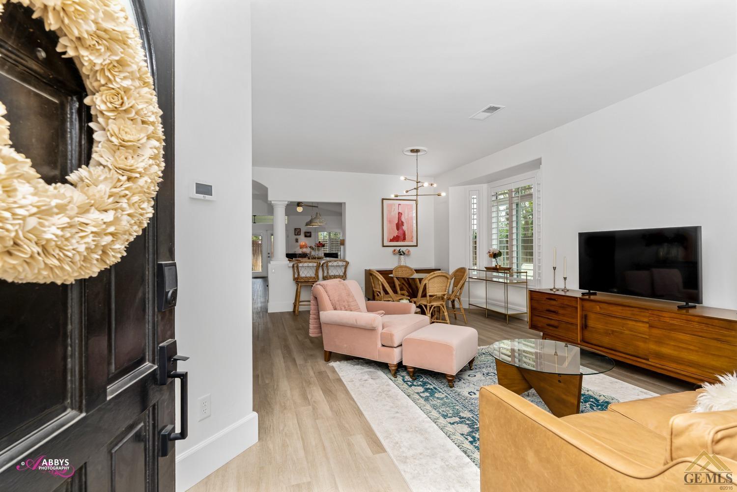 Undisclosed Address Bakersfield, CA 93311 - Photo 6 of 48 a living room with furniture and a flat screen tv
