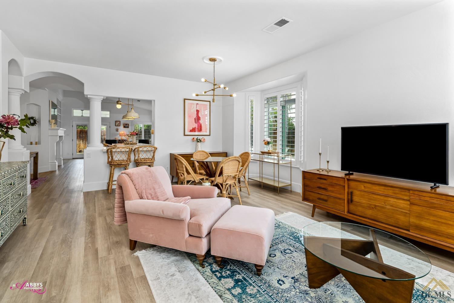 Undisclosed Address Bakersfield, CA 93311 - Photo 7 of 48 a living room with furniture and a flat screen tv