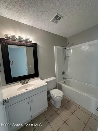 a bathroom with a sink a toilet and bathtub