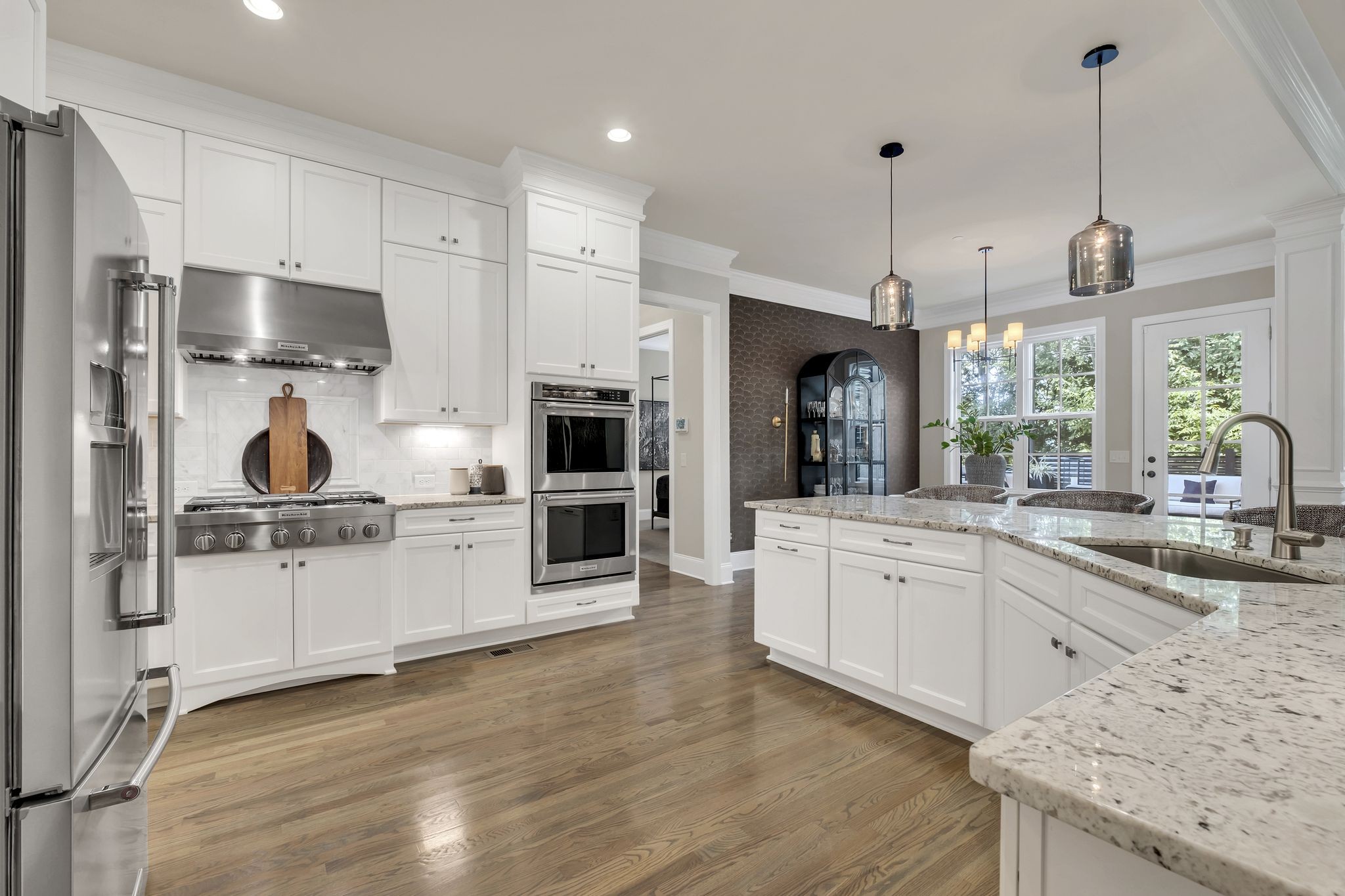 1043 Firestone Drive Franklin, TN 37067 - Photo 18 of 61 a kitchen with stainless steel appliances granite countertop a stove a sink and a refrigerator