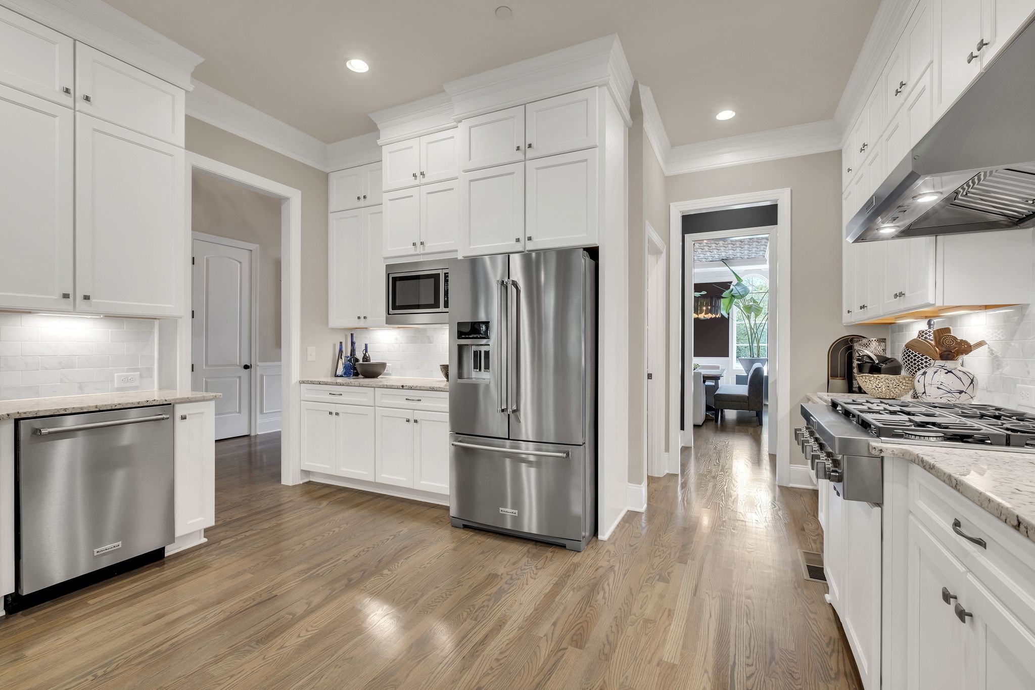 1043 Firestone Drive Franklin, TN 37067 - Photo 20 of 61 a kitchen with wooden floors and stainless steel appliances