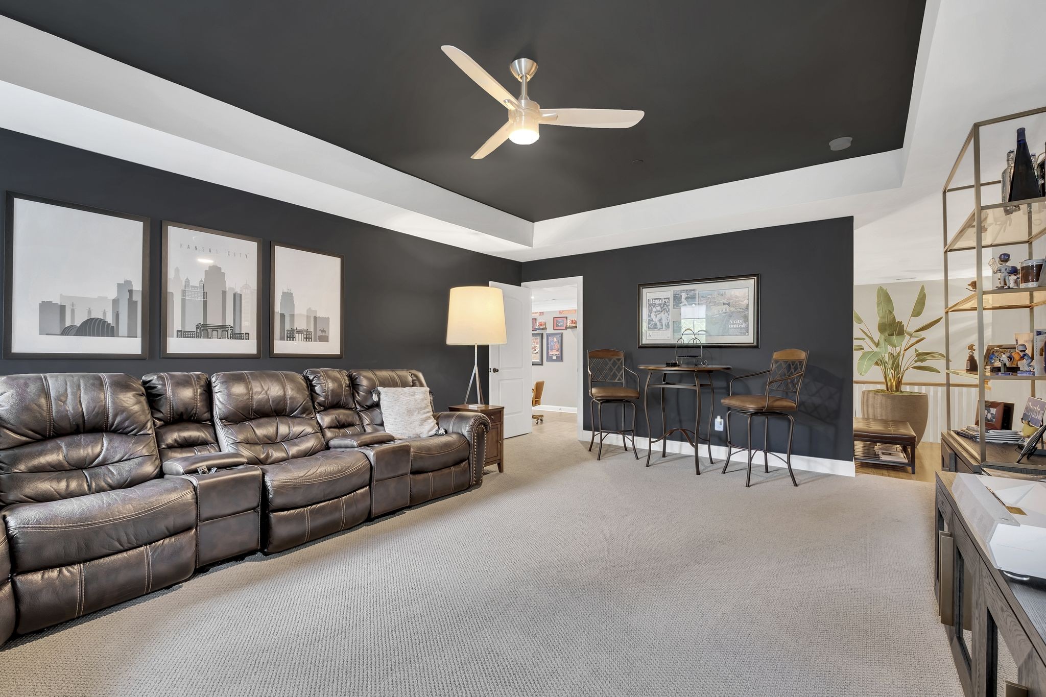 1043 Firestone Drive Franklin, TN 37067 - Photo 26 of 61 a living room with furniture a ceiling fan and a flat screen tv
