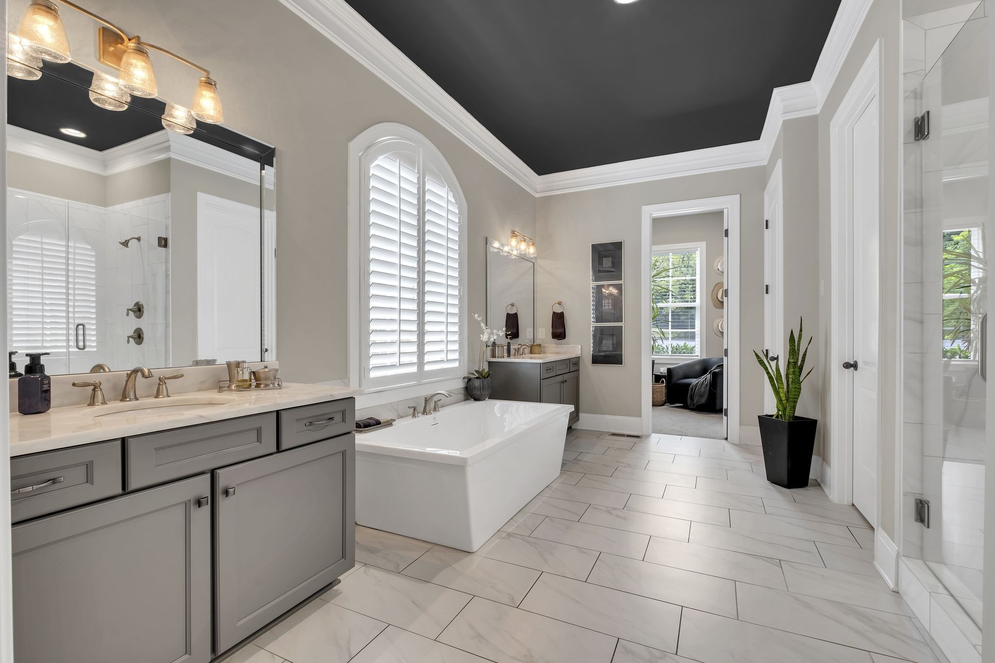 1043 Firestone Drive Franklin, TN 37067 - Photo 30 of 61 a large white bathroom with a double vanity sink a mirror and a bathtub