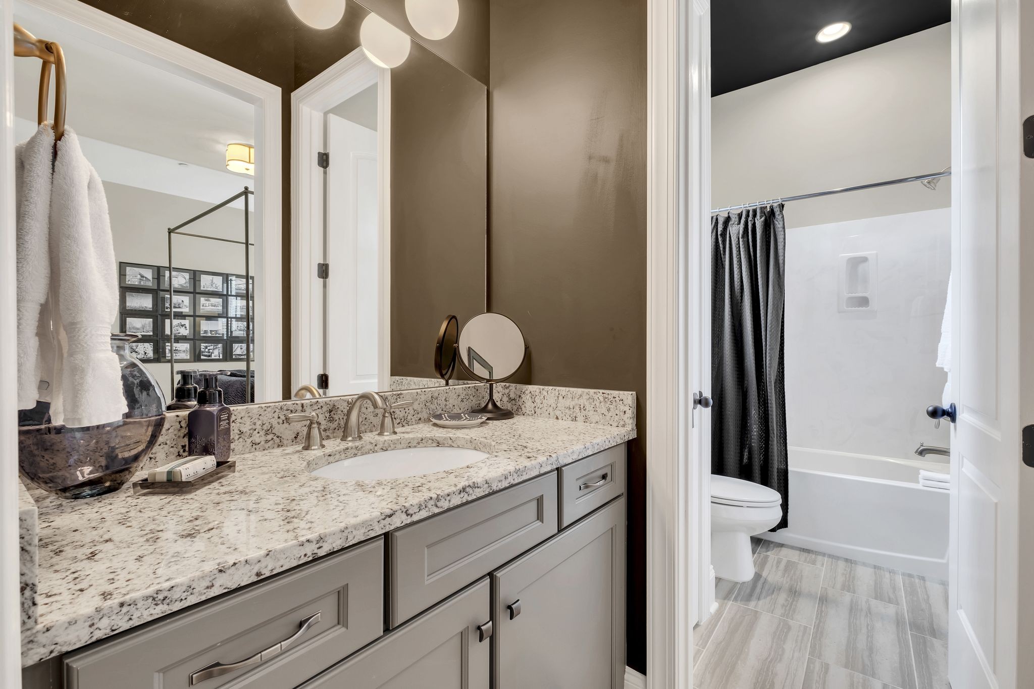 1043 Firestone Drive Franklin, TN 37067 - Photo 36 of 61 a bathroom with a granite countertop sink and a mirror
