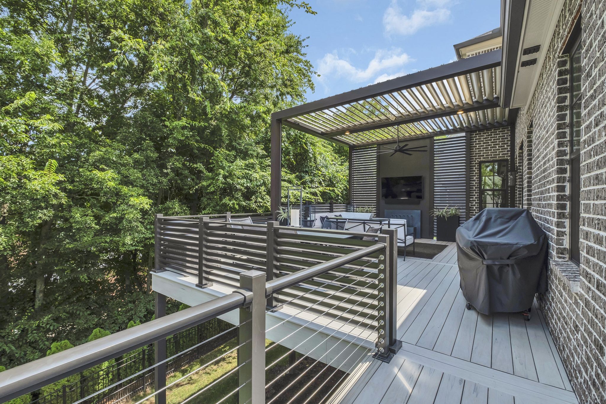 1043 Firestone Drive Franklin, TN 37067 - Photo 56 of 61 a view of a deck with couches table and chairs with wooden floor and fence
