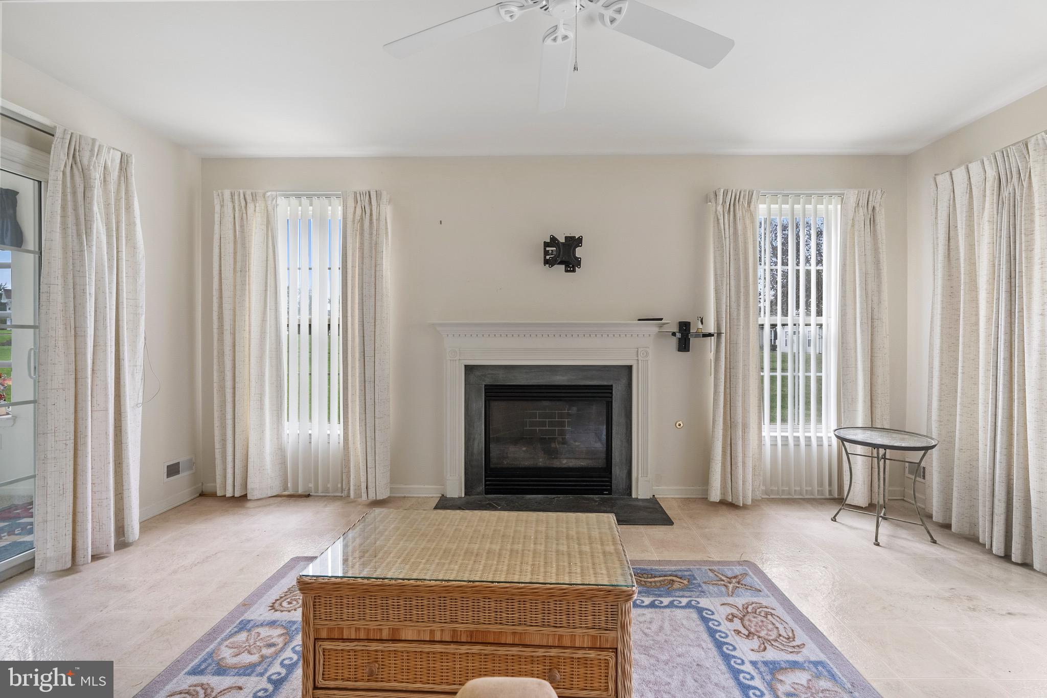 26 Carriage Berlin, NJ 08009 - Photo 12 of 19 a living room with a fireplace and a rug