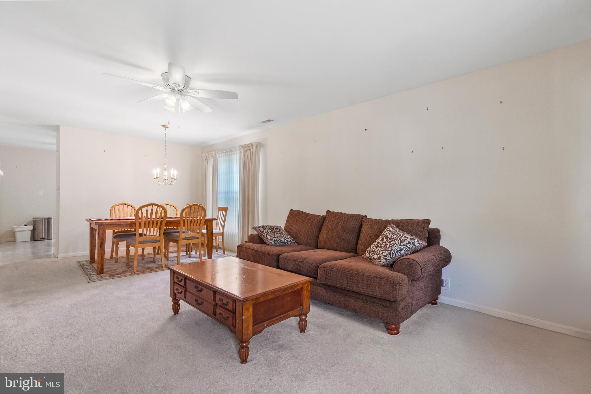 26 Carriage Berlin, NJ 08009 - Photo 4 of 19 a living room with furniture and a chandelier