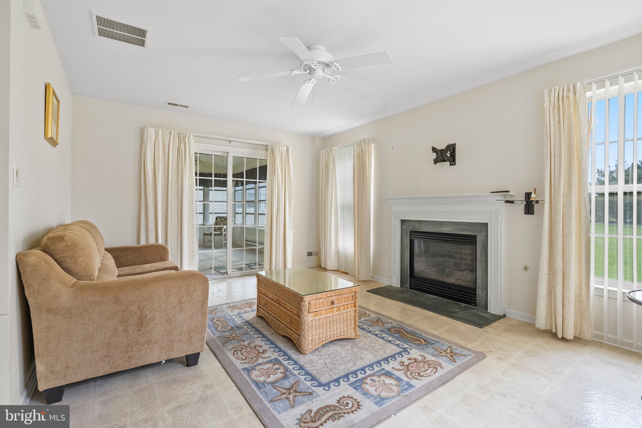 26 Carriage Berlin, NJ 08009 - Photo 10 of 19 a living room with furniture and a fireplace