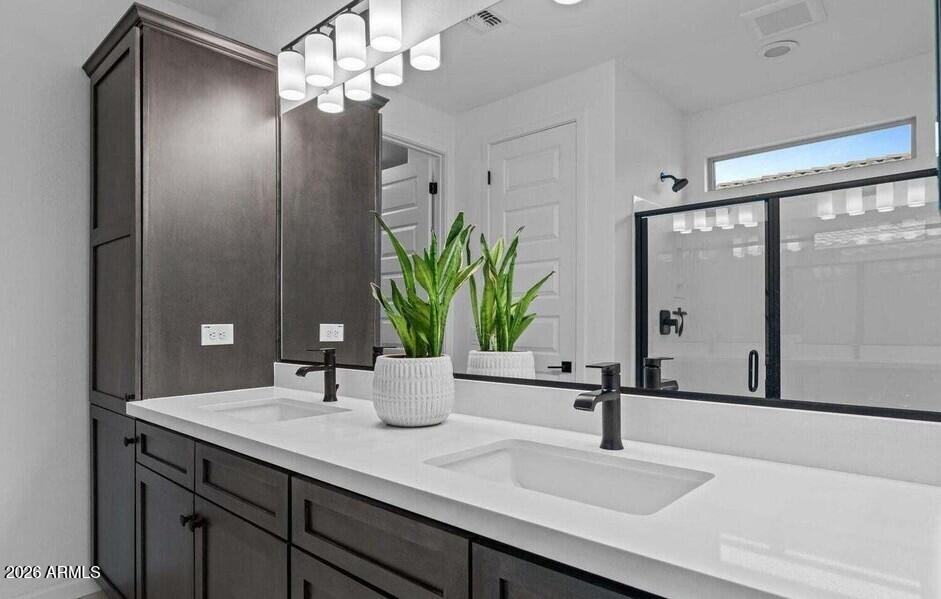 4540 Jackpot Road Wickenburg, AZ 85390 - Photo 7 of 13 a bathroom with a sink and a mirror