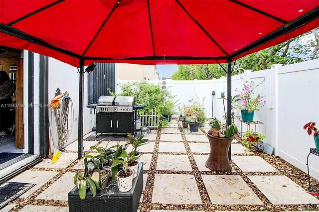 a patio with table and chairs