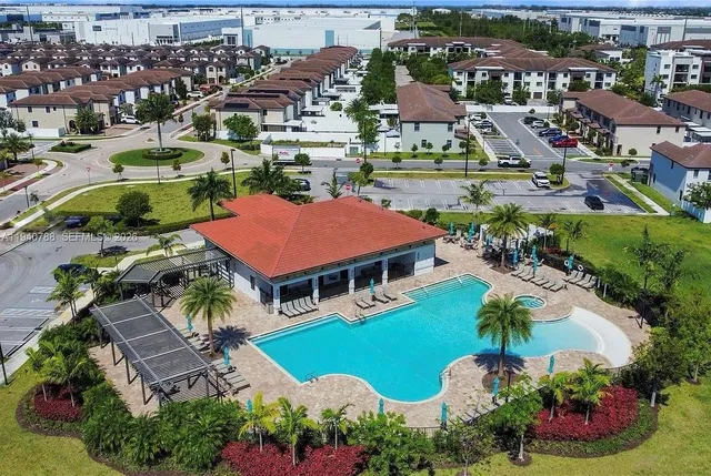 an aerial view of residential houses and street