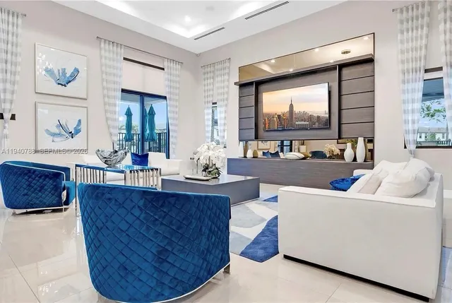 a living room with furniture and a large window