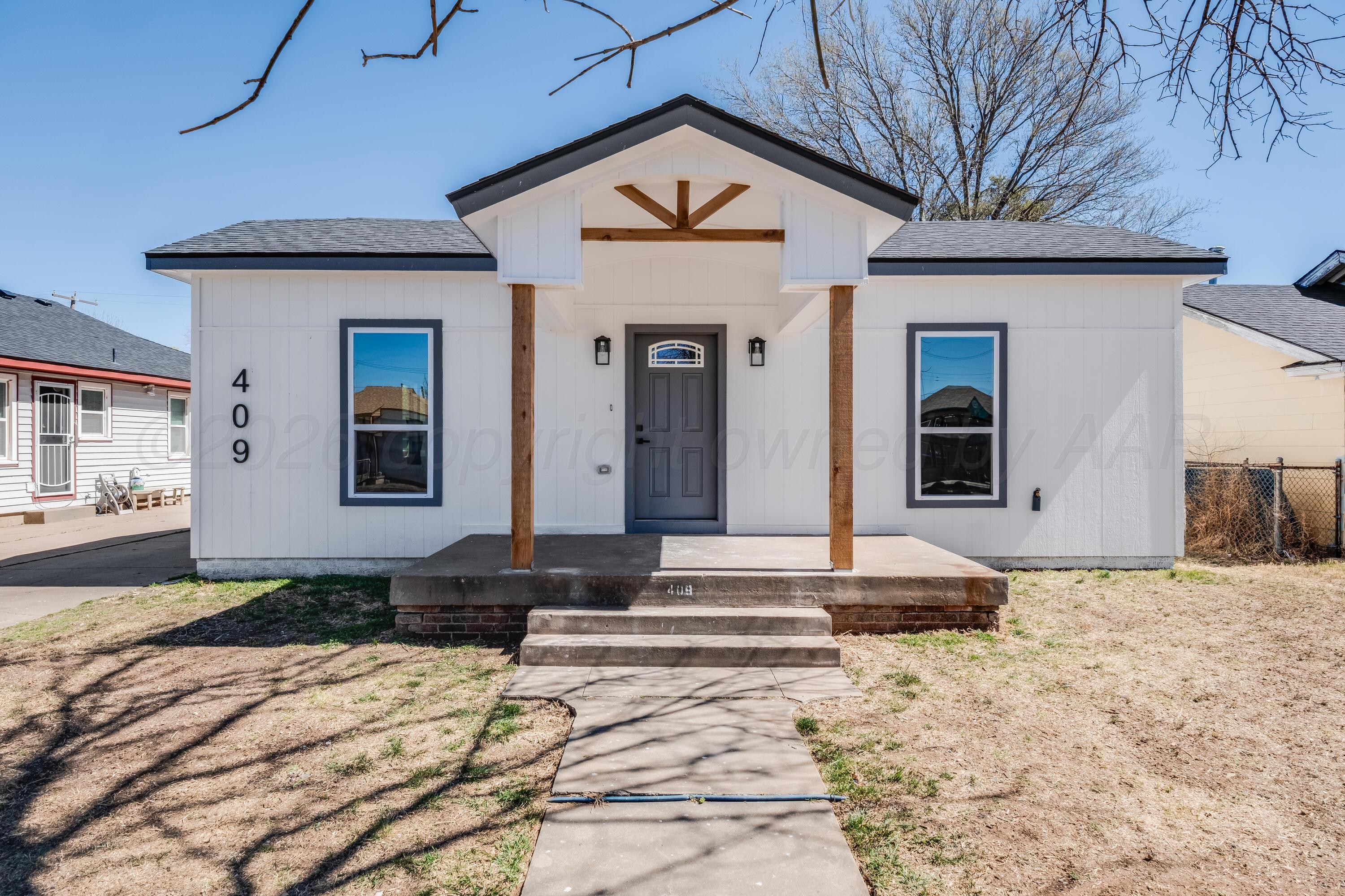 409 South Forest Street Amarillo, TX 79106 - Photo 1 of 18 a front view of a house with a yard
