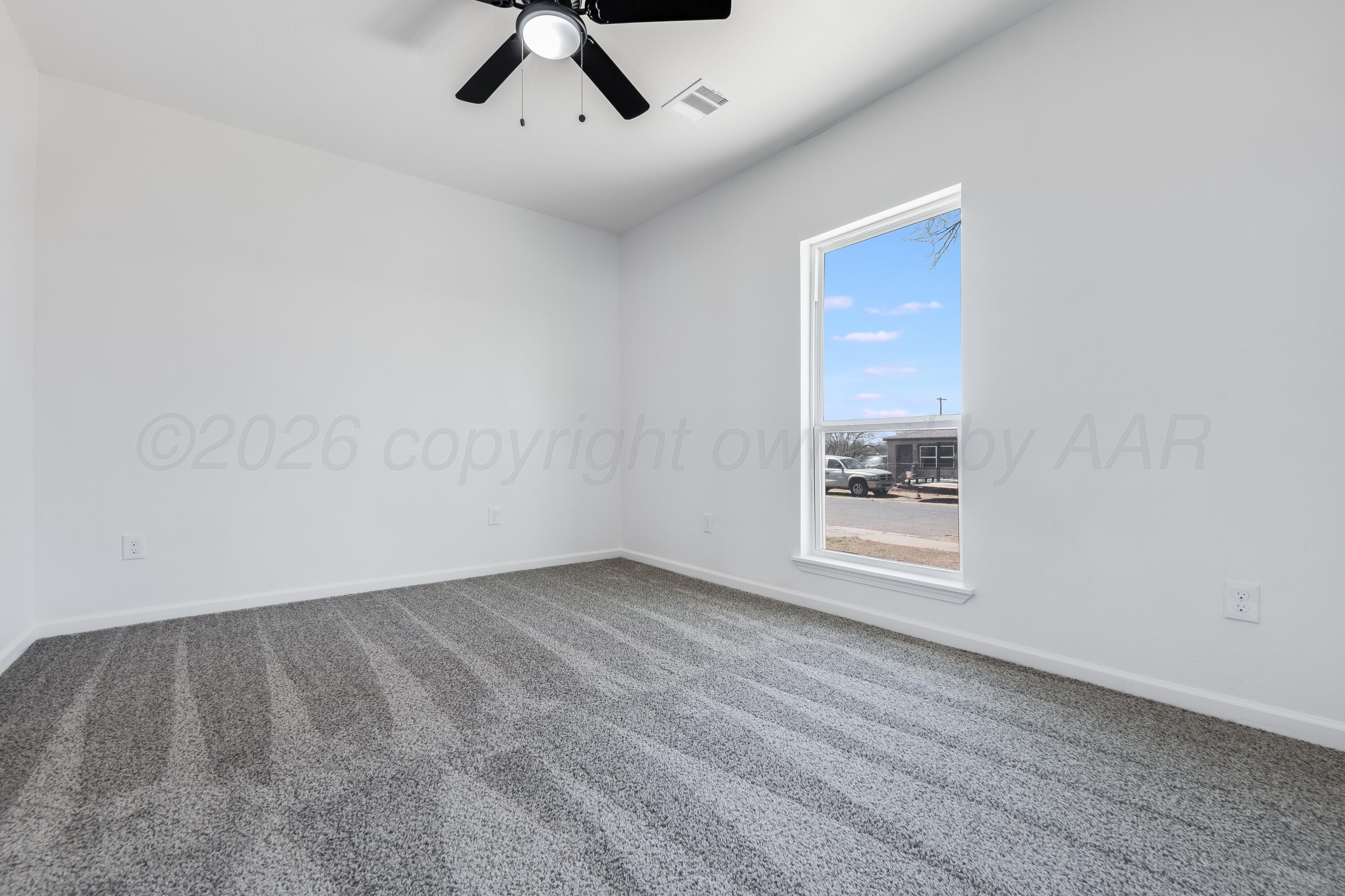409 South Forest Street Amarillo, TX 79106 - Photo 11 of 18 a view of an empty room with a window