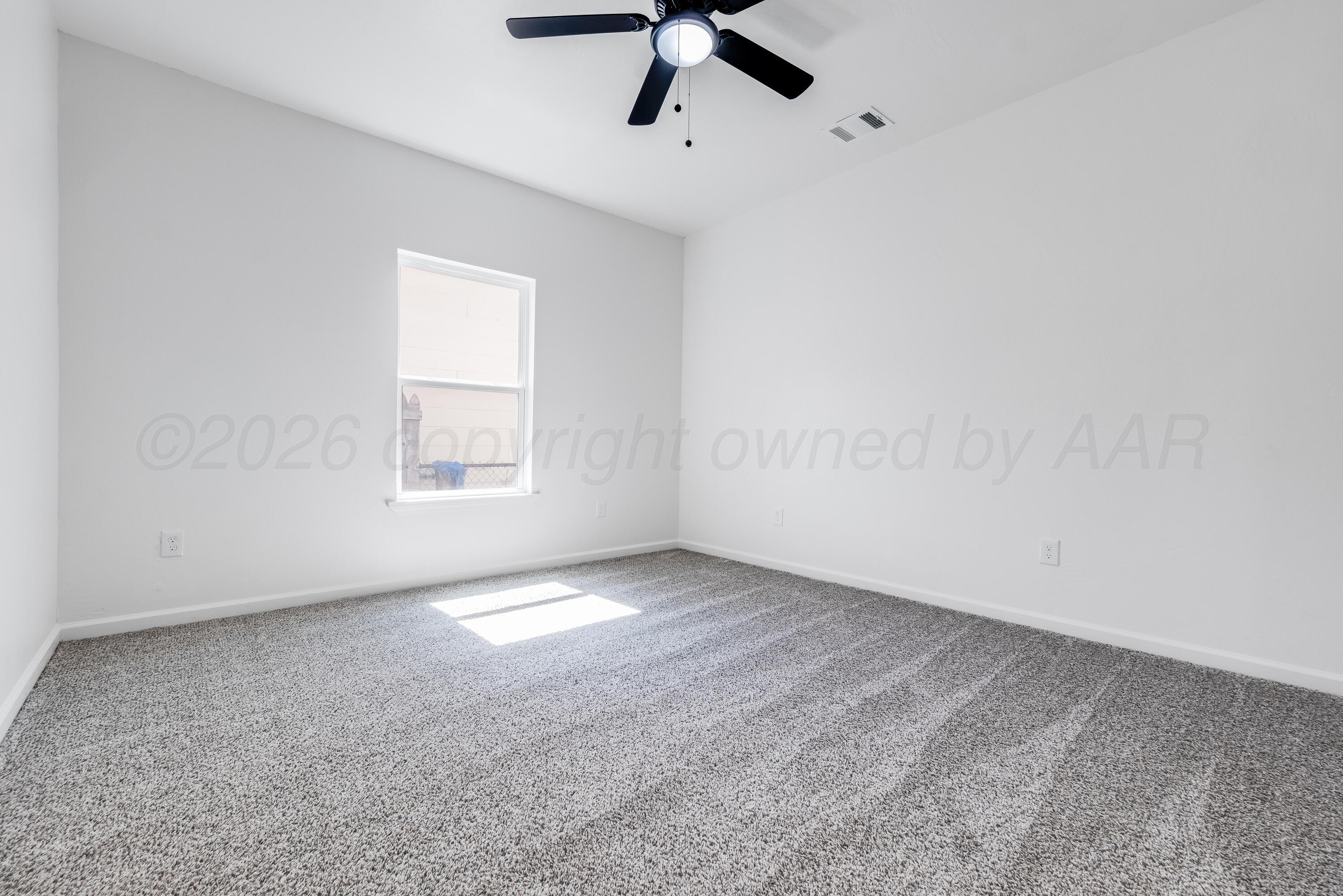 409 South Forest Street Amarillo, TX 79106 - Photo 13 of 18 a view of an empty room with a window