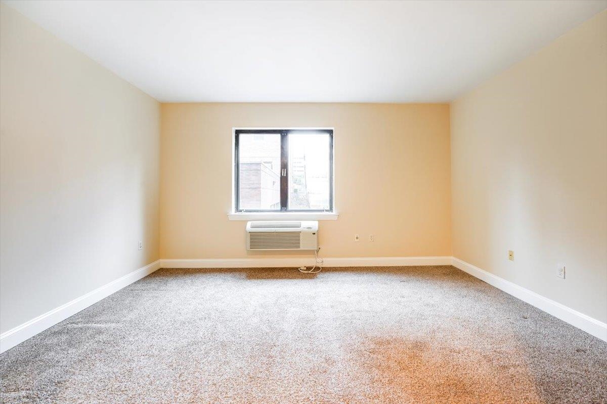 29 1st Street, Unit 408 Hackensack, NJ 07601 - Photo 9 of 29 an empty room with a window