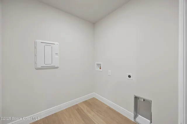 a view of a small space with wooden floor