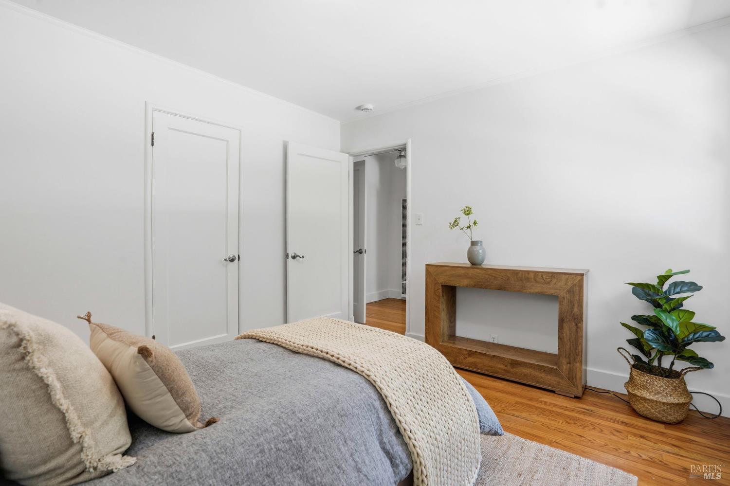 234 Solano Street San Rafael, CA 94901 - Photo 14 of 24 a bedroom with a bed and a potted plant