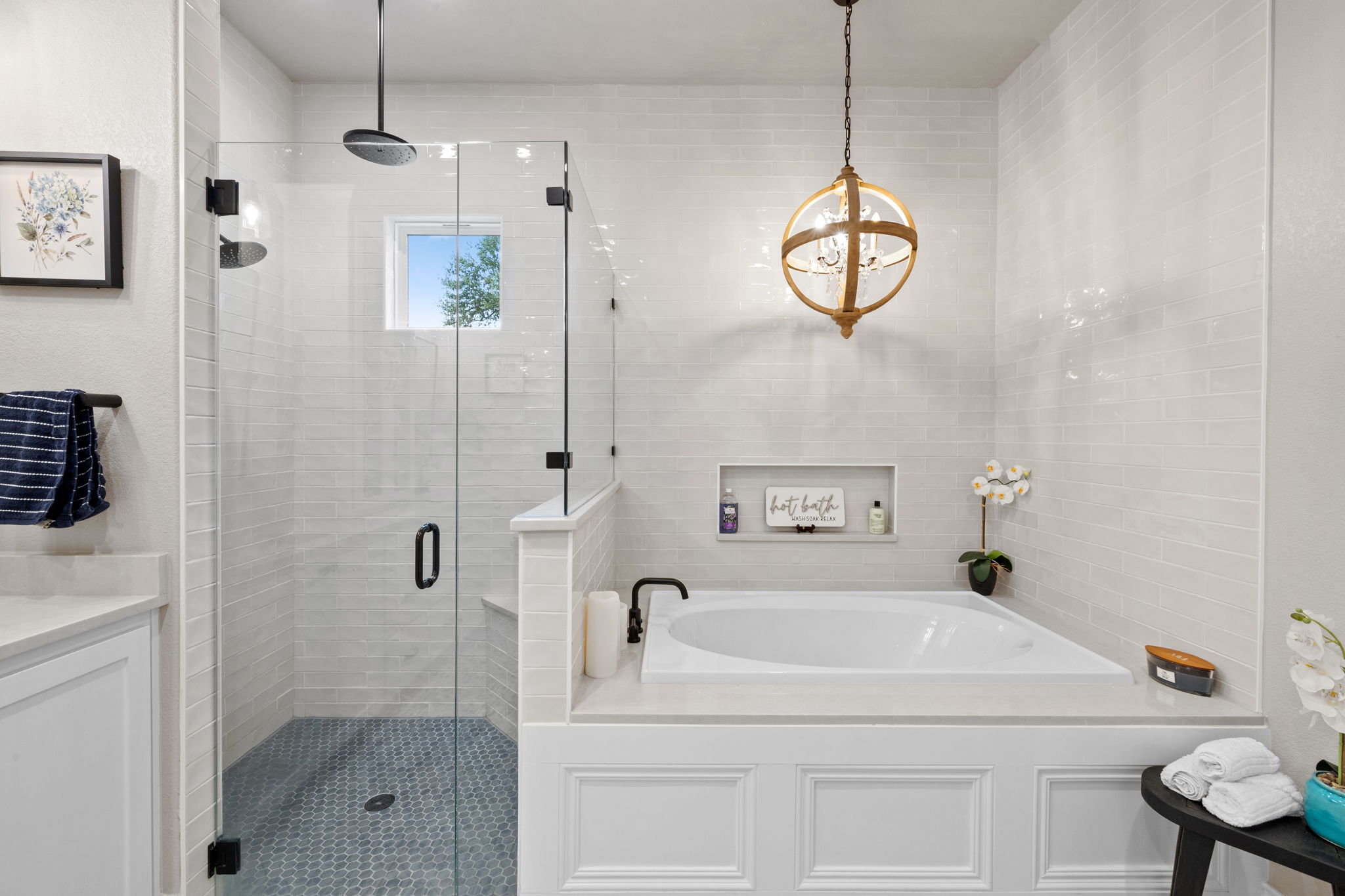 104 Lower Cedar Cove Georgetown, TX 78633 - Photo 17 of 37 a bathroom with a sink a mirror a window and a shower