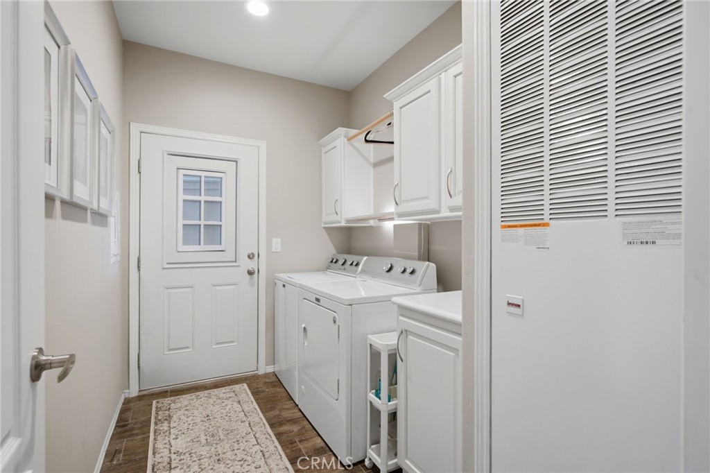 1051 Site, Unit 21 Brea, CA 92821 - Photo 22 of 25 Laundry Room with Storage & Door to Garage