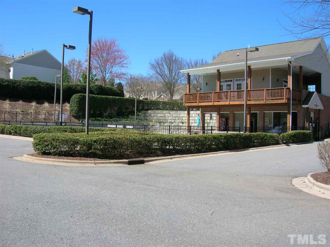 8308 City Loft Court Raleigh, NC 27613 - Photo 22 of 23 a front view of a building with garden