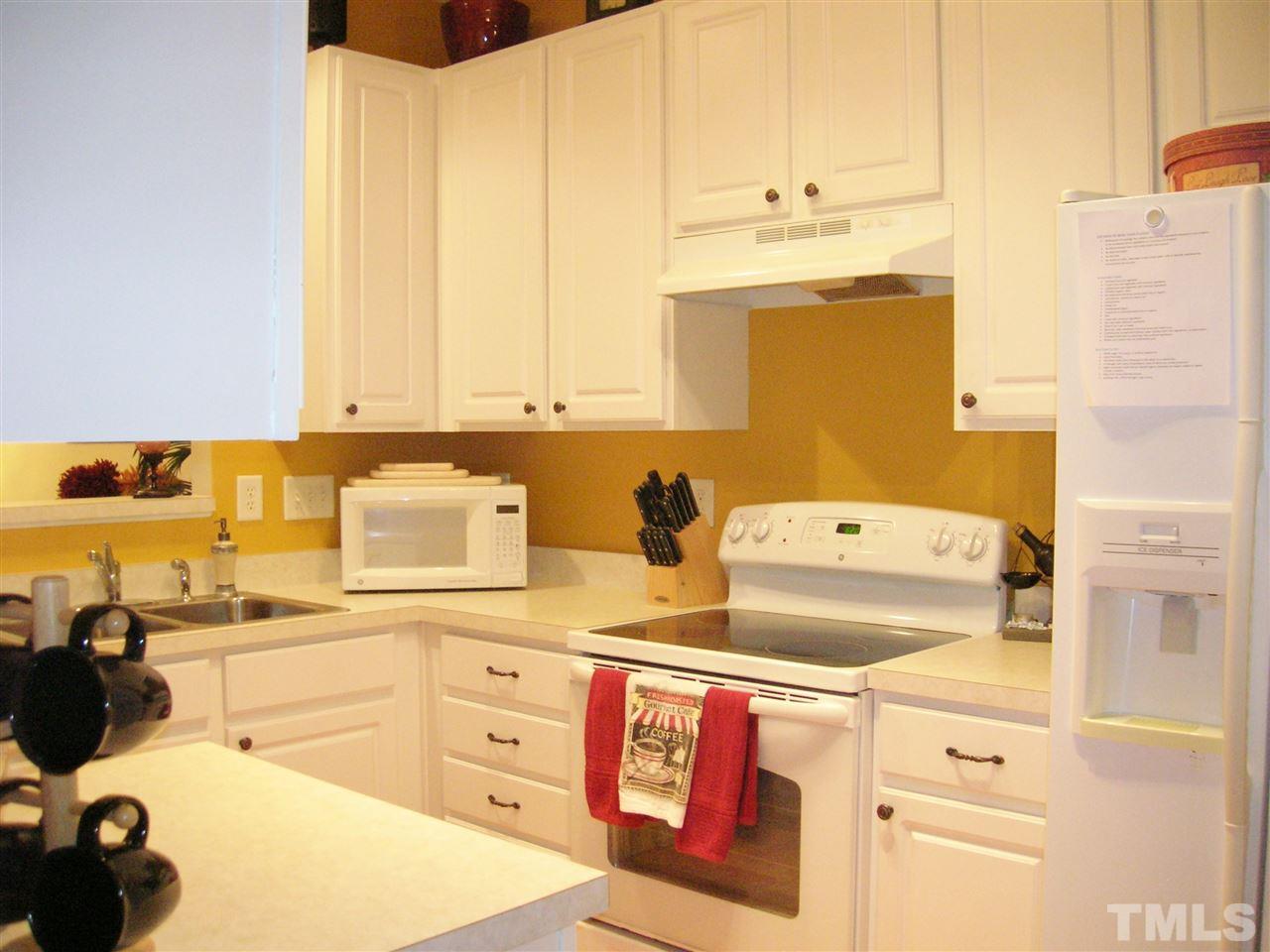 8308 City Loft Court Raleigh, NC 27613 - Photo 8 of 23 a utility room with dryer and washer