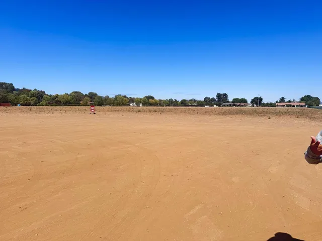 a view of a lake with houses in the back